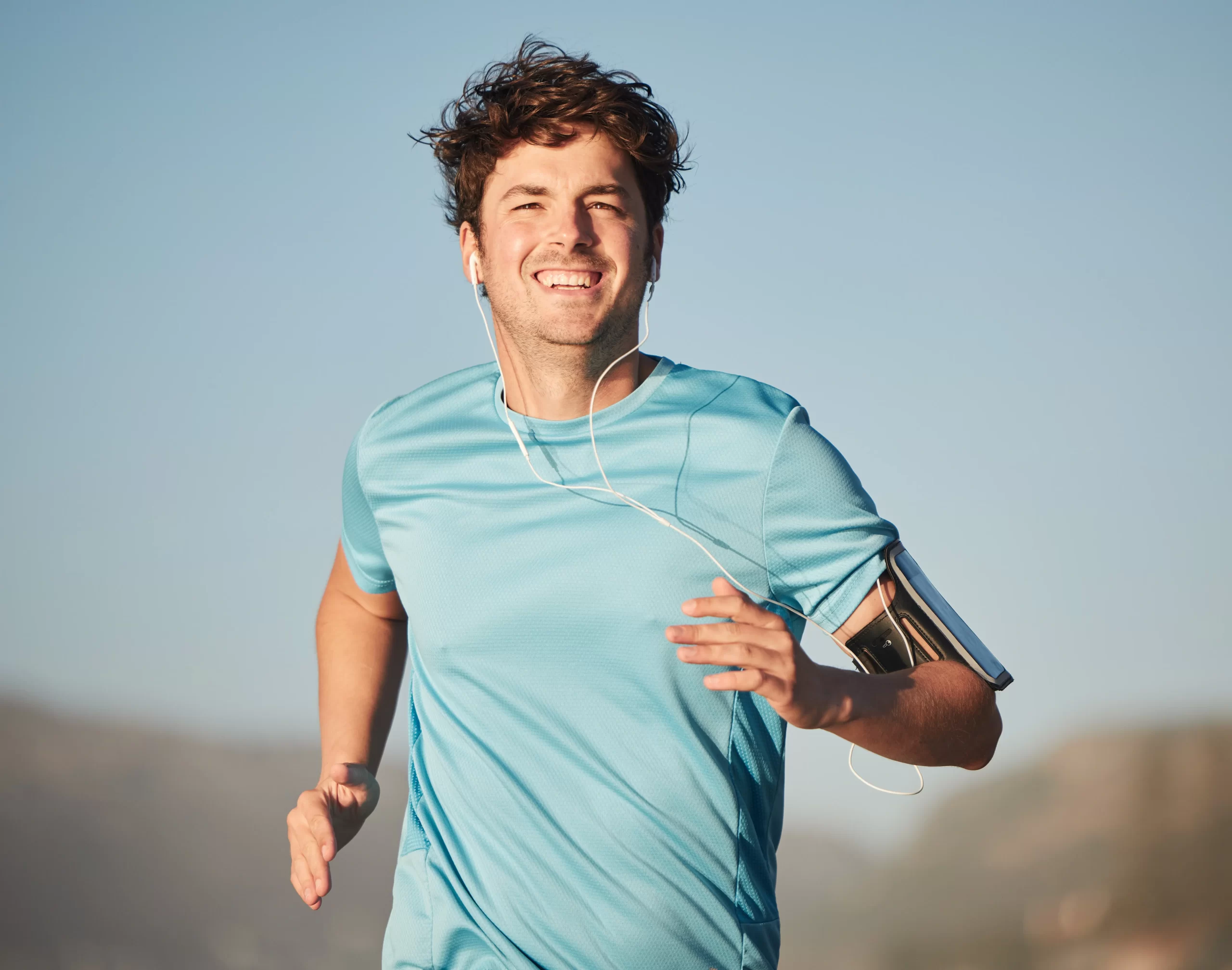 https://mopeclinic.com/wp-content/uploads/2024/11/happy-running-and-man-athlete-with-music-steaming-2023-11-27-05-11-19-utc-scaled.webp