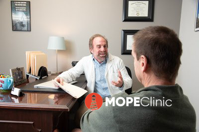Chris Rue from MOPE Clinic consulting with a patient about medical weight loss